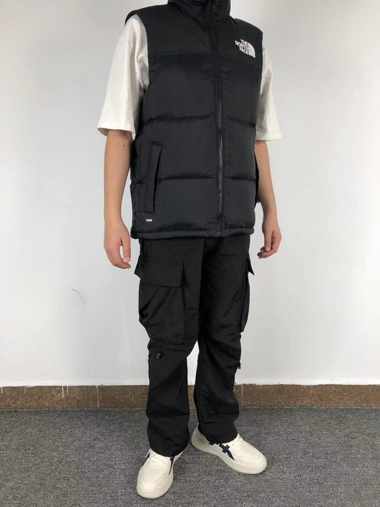 Black puffer gilet worn, side