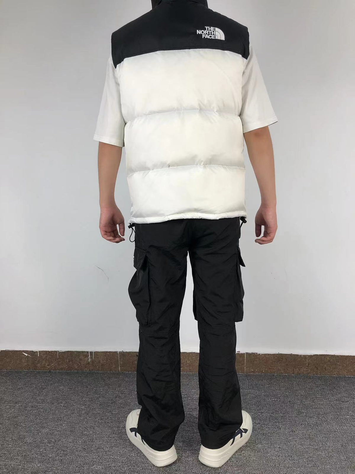 White puffer gilet worn, back