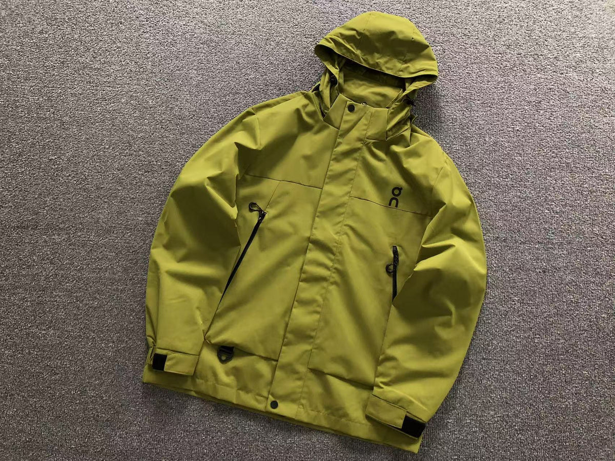 Moss hooded shell jacket with zip chest pockets and velcro cuffs