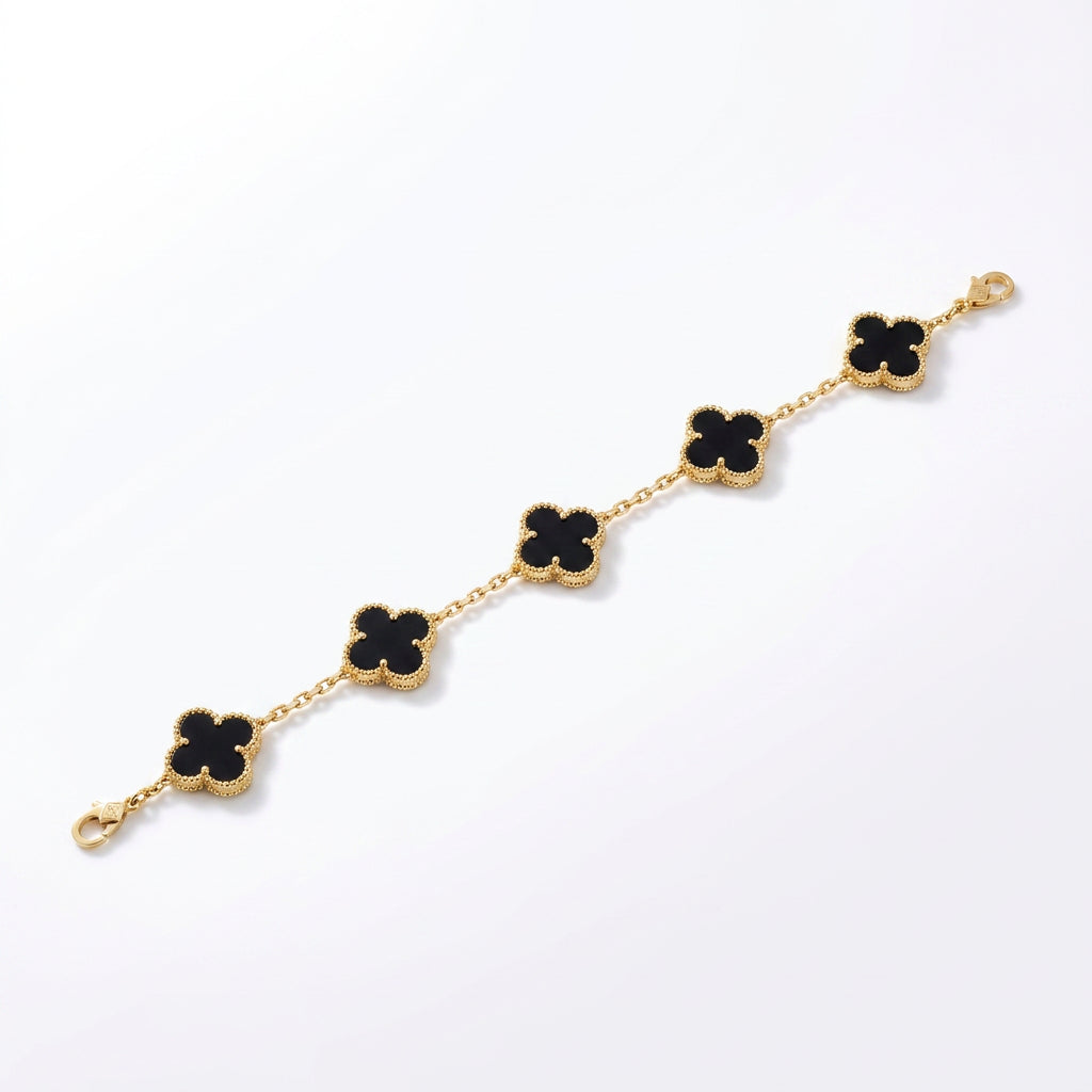 Black onyx and yellow gold clover bracelet