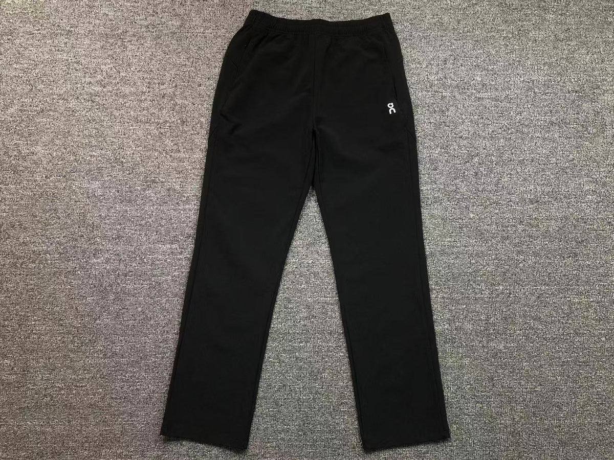 Women's straight leg pants in black, flat lay