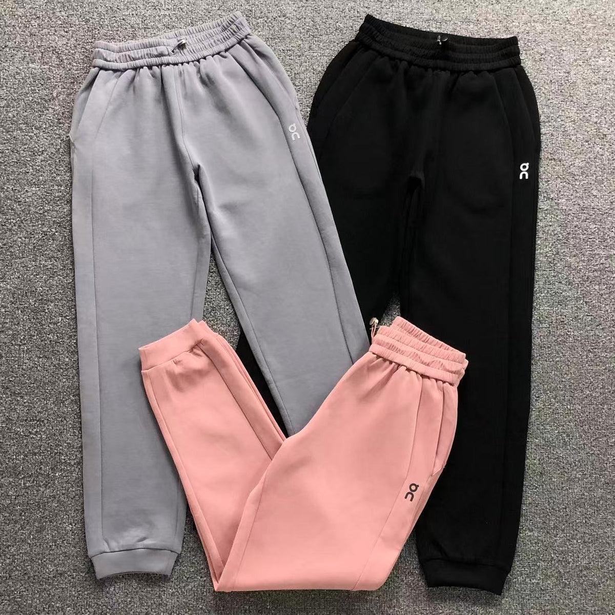 Women's cuffed joggers in grey, black and pink