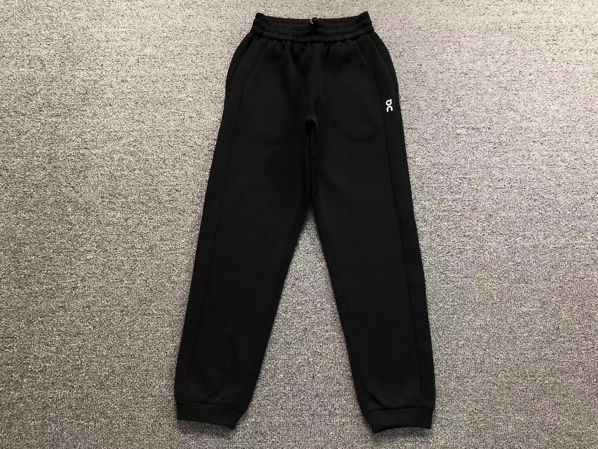 Women's cuffed joggers in black, flat lay