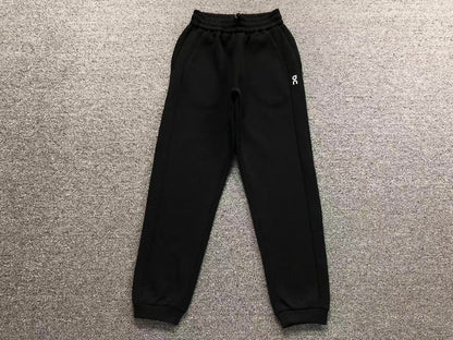 Women's cuffed joggers in black, flat lay
