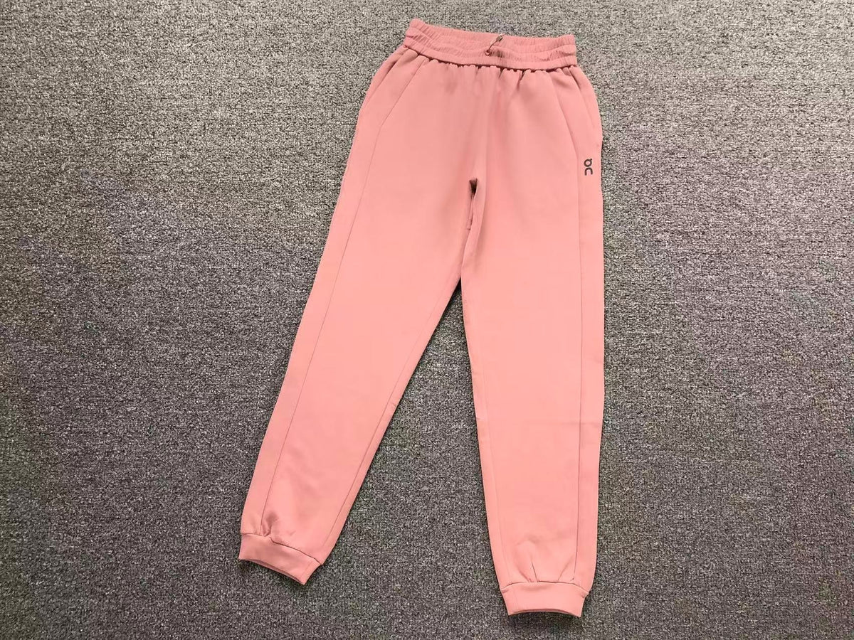 Women's cuffed joggers in pink, flat lay