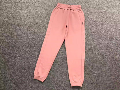 Women's cuffed joggers in pink, flat lay