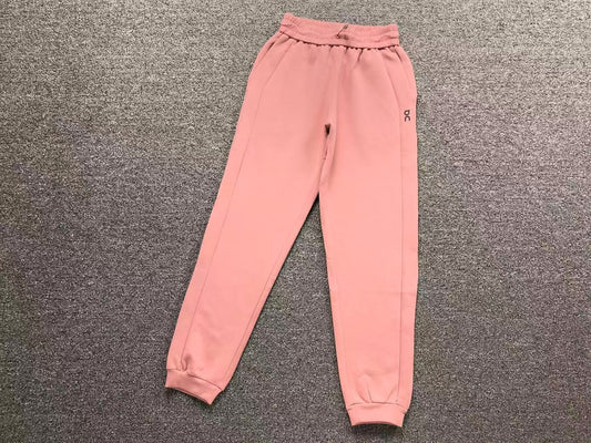 Women's cuffed joggers in pink, flat lay