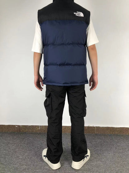 Navy puffer gilet worn, back