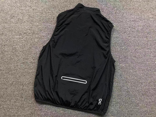 Black running gilet, back with reflective zip pocket