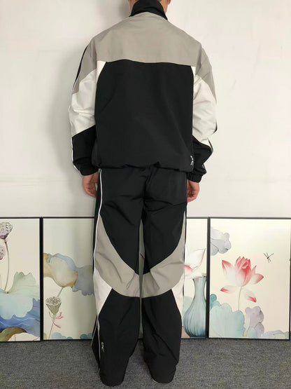 Black colour block tracksuit worn, back view