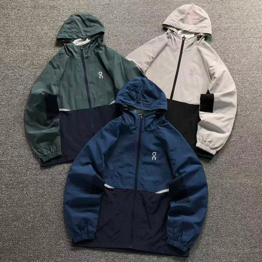 Colour block hooded windbreakers in teal, stone and blue