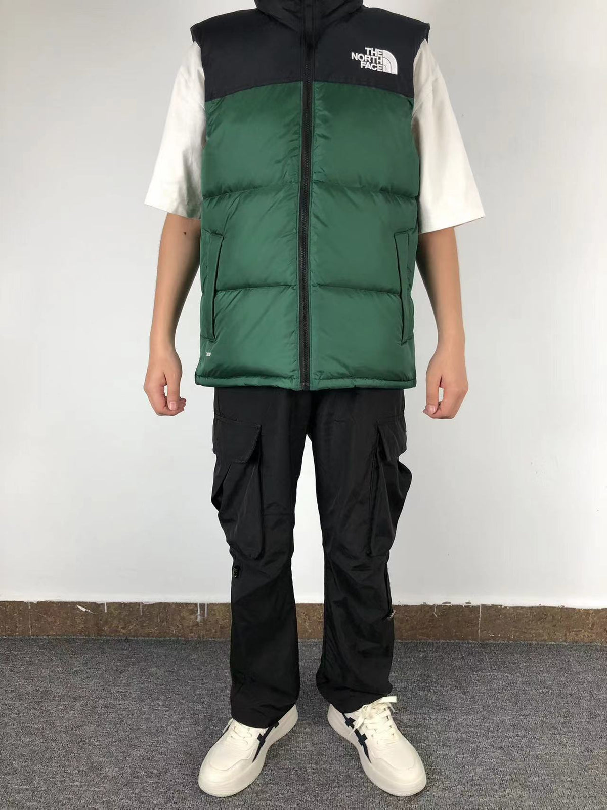 Green puffer gilet worn, front