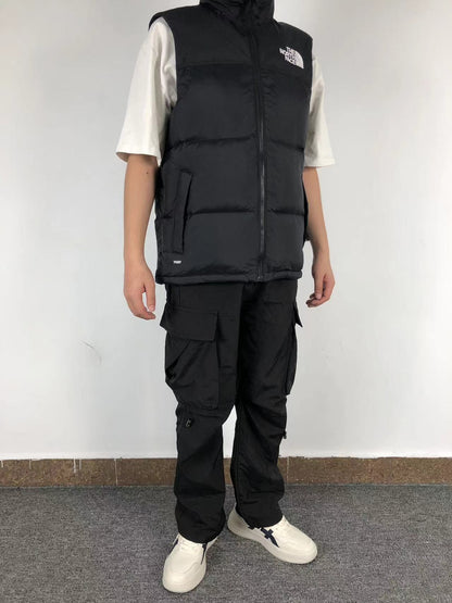 Black puffer gilet worn, side