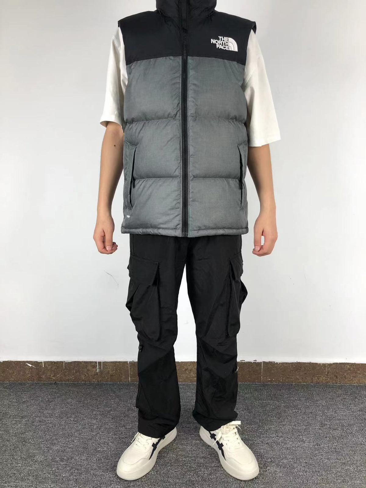 Grey puffer gilet worn, front