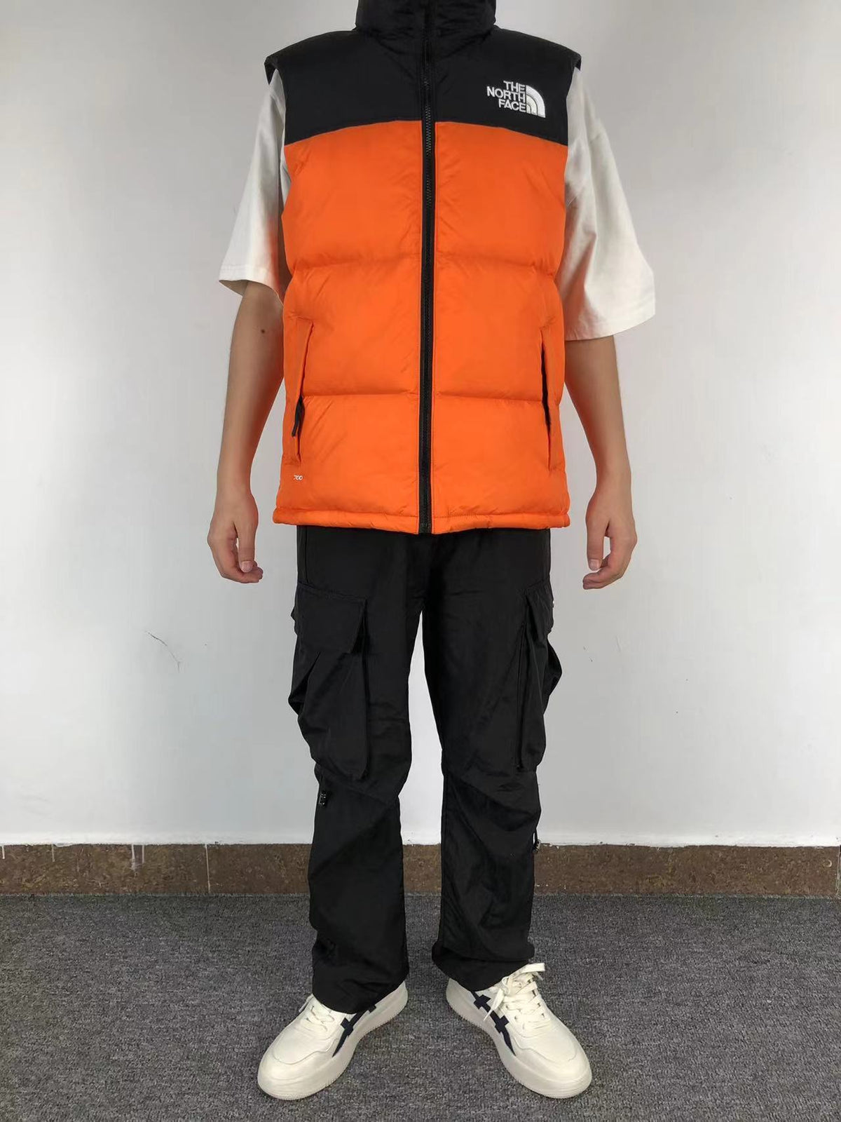 Orange puffer gilet worn, front