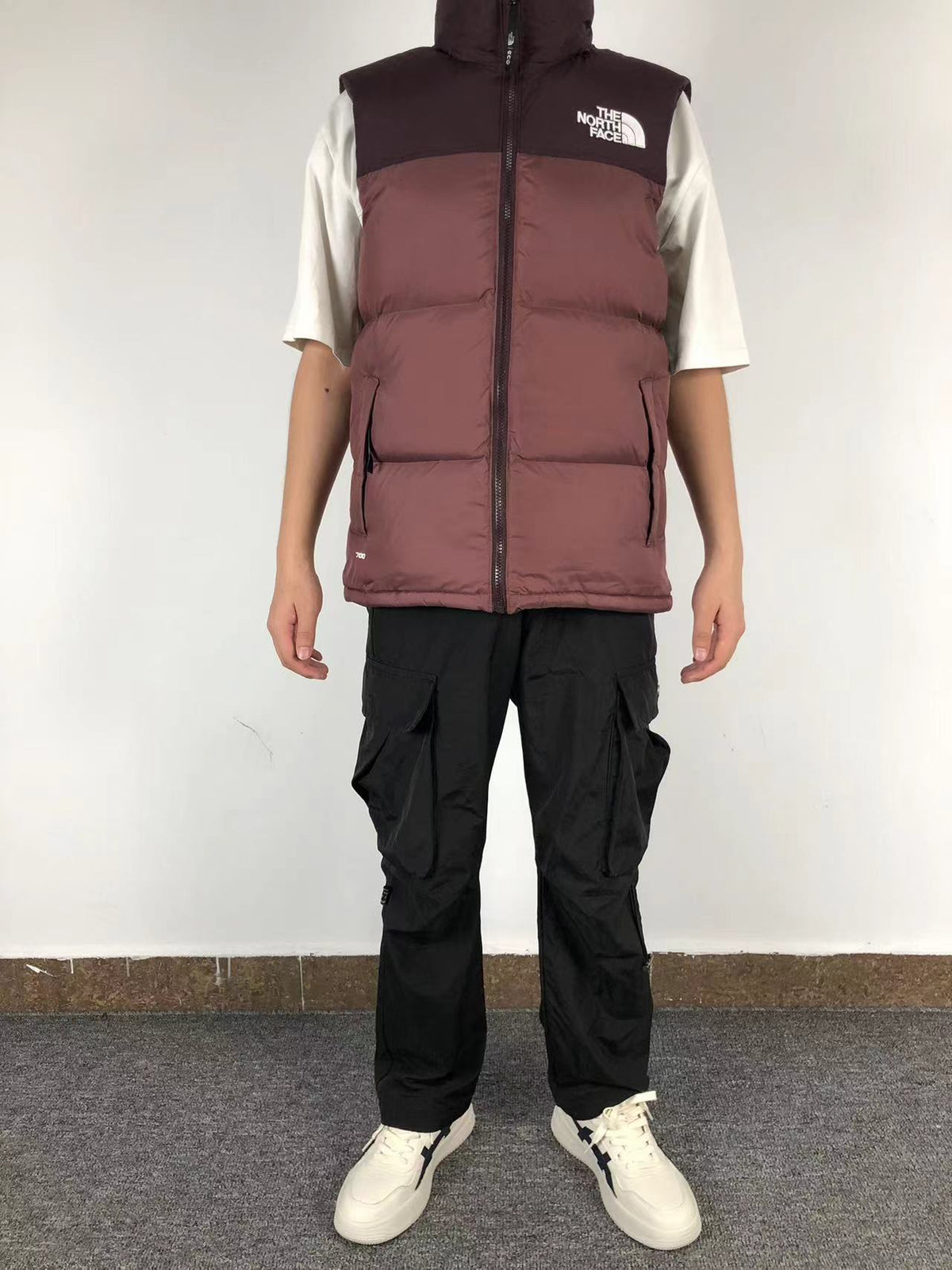 Burgundy puffer gilet worn, front