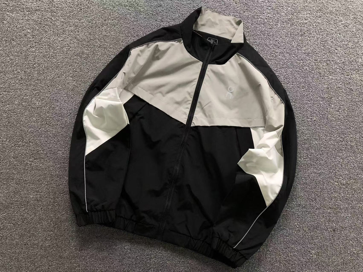 Black colour block track jacket with grey and white panels