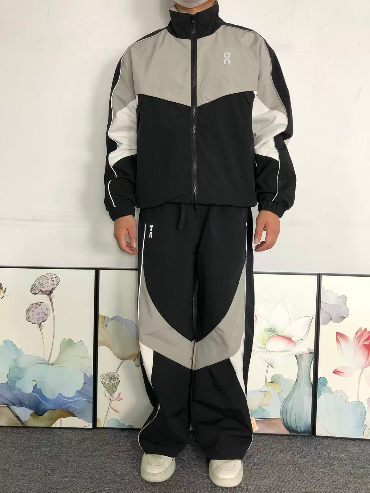 Black colour block tracksuit worn, front view