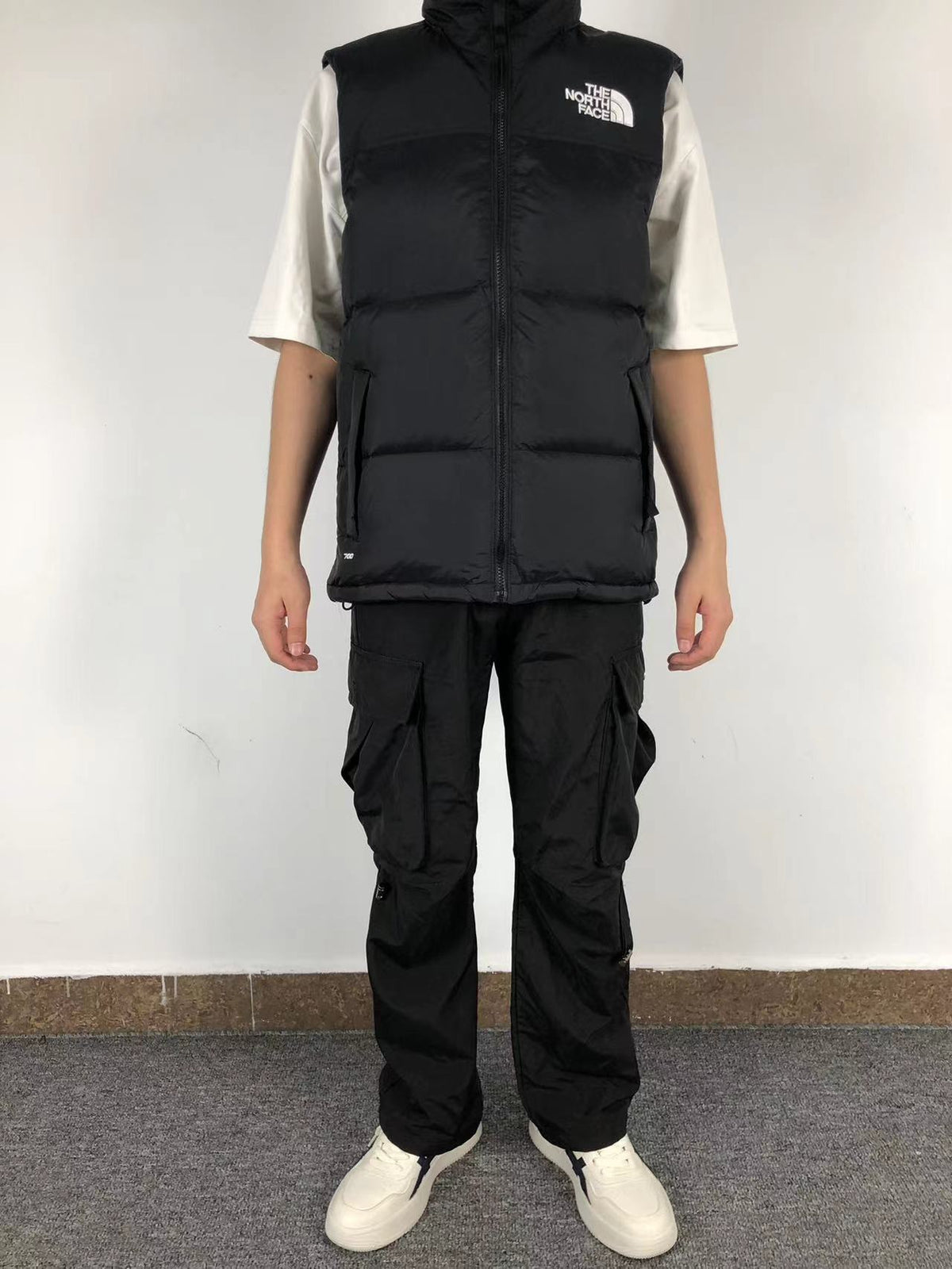 Black puffer gilet worn, front