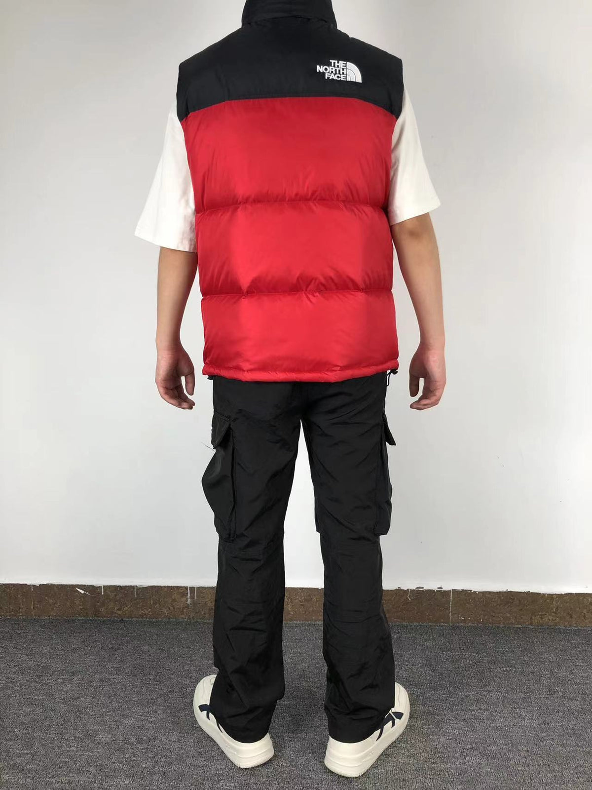 Red puffer gilet worn, back
