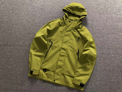 Moss hooded shell jacket with zip chest pockets and velcro cuffs