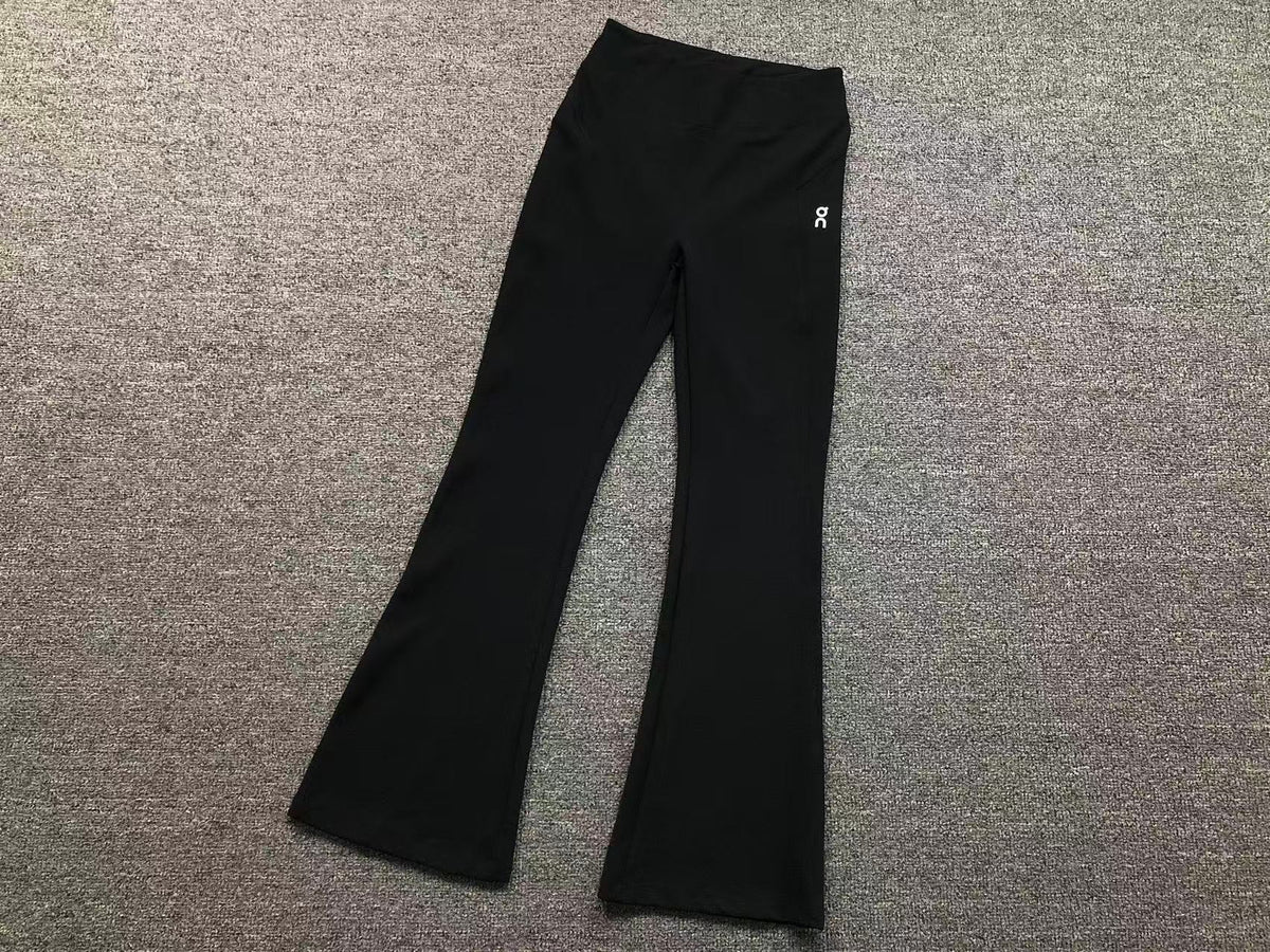 Women's high waisted flared pants in black, flat lay