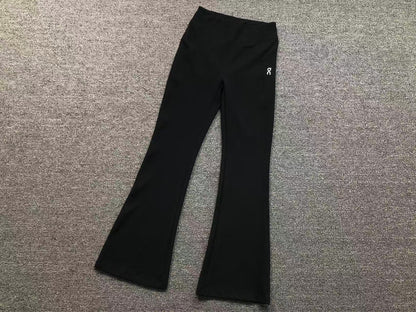 Women's high waisted flared pants in black, flat lay