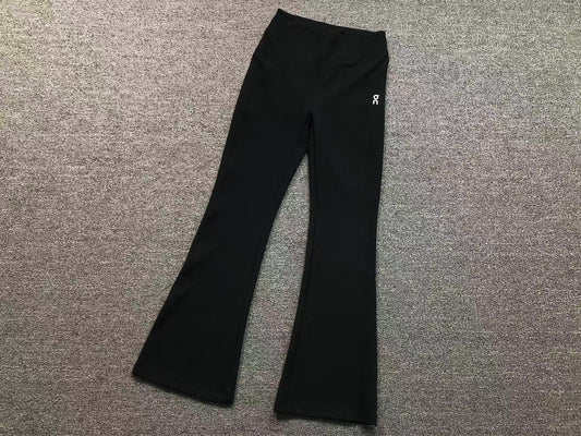 Women's high waisted flared pants in black, flat lay