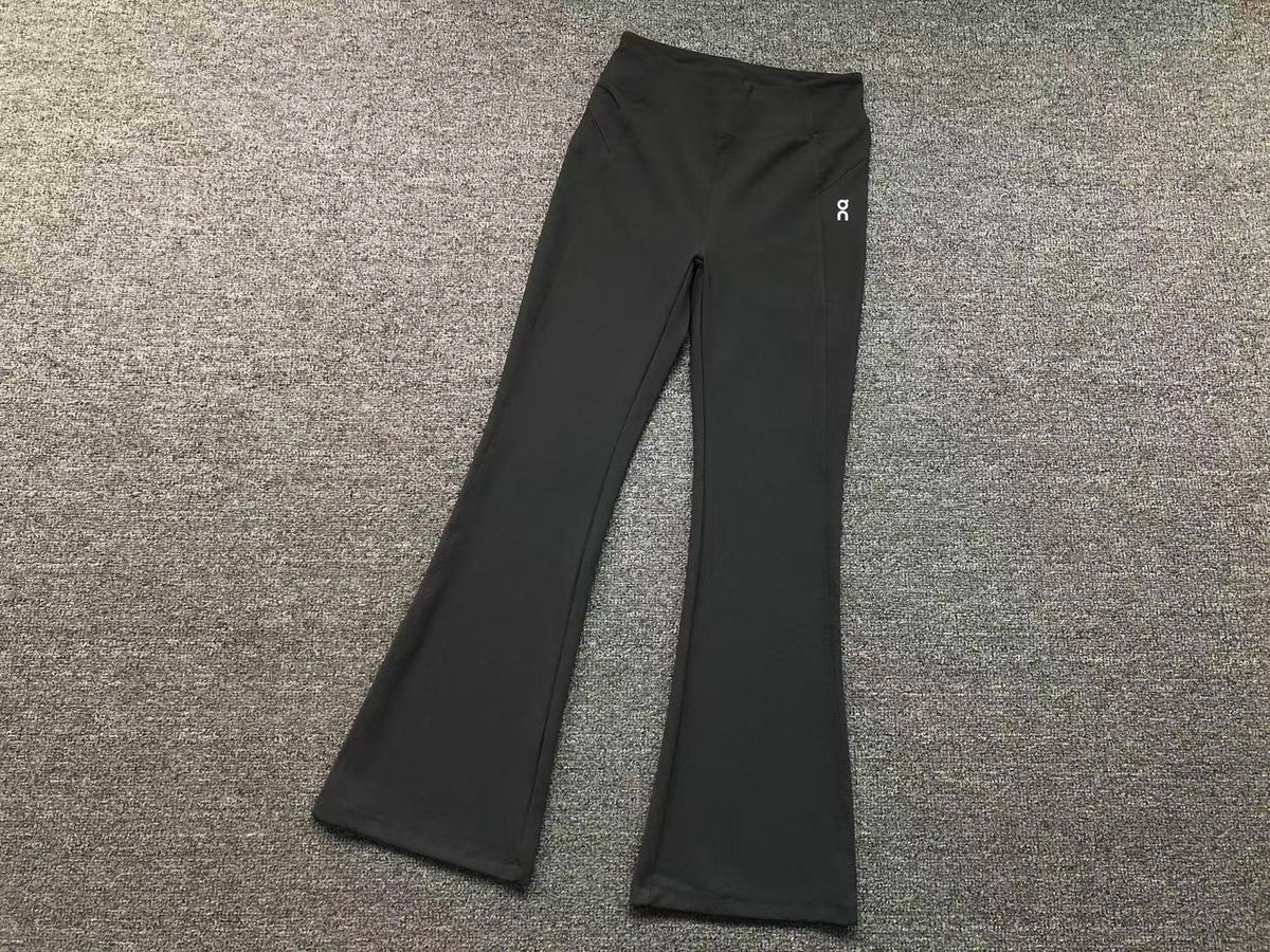 Women's high waisted flared pants in charcoal, flat lay