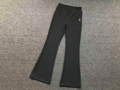 Women's high waisted flared pants in charcoal, flat lay