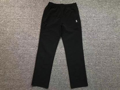 Women's straight leg pants in black, flat lay